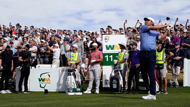 Scottie Scheffler tees off in the final round of the WM Phoenix Open.